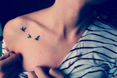 Small-Flying-Bird-on-Chest-Tattoo