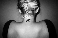 awful-small-bird-tattoo-on-neck-back