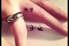 two-small-bird-finger-tattoo